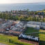 Luftfoto af Novonesis enzymfabrik på Sundsnæs i Gråsten med Flensborg Fjord i baggrunden