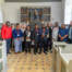Delegationen fra Tanzania samlet til gruppebillede med værter i Rinkenæs Gamle Kirke